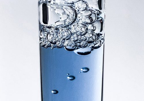 Closeup macro photography of blue liquid in a dropper with bubbles and foam. Featuring kbeauty brand Dear Klairs's Midnight Blue Youth Activating Drop Serum