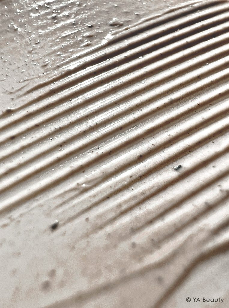 Omorovicza Deep Cleansing mask's mud and clay textures, photographed editorially in a closeup with macro photography.