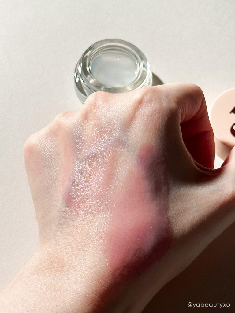 EspressOh Glassy Blush review featuring the product color swatched on fair pale hand, photographed in editorial photo style on white background.